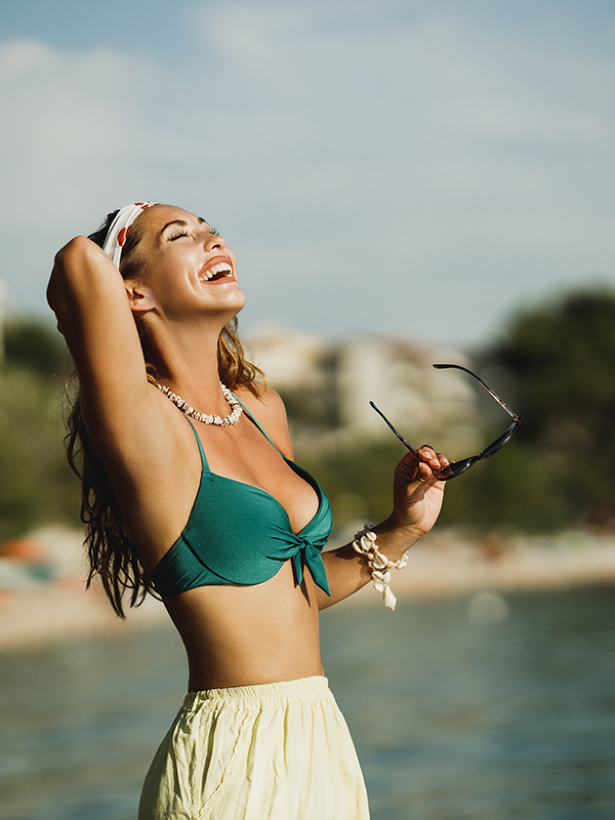 Finally I Get On The Beach In Corona Time An attractive young woman in bikini is having fun on the beach and enjoying a summer vacation.